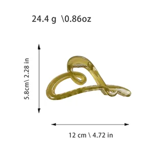 Translucent yellow heart-shaped plastic hair claw clip with size and weight measurements