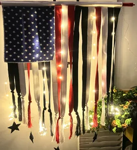 Close-up of patriotic American flag fabric bunting with LED lights and star pendants
