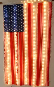 Detail of USA flag LED banner with warm light beads and white lace hollow fabric