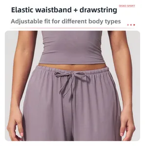 Close-up of the elastic waistband and adjustable drawstring on lavender sports pants