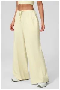 Detail of high waist elastic waistband with adjustable drawstring on wide leg pants