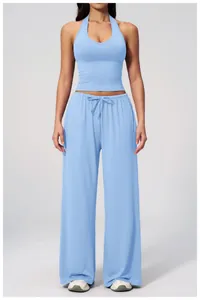 Women's light blue two-piece set featuring halter top and wide-leg drawstring pants