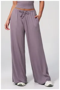 Detail view of lavender wide-leg trousers showing elastic waistband and drawstring