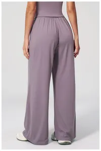 Rear view of loose high-waisted wide-leg yoga pants in dusty purple soft fabric
