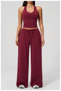Close-up of burgundy high-waist drawstring wide-leg pants and soft fabric texture