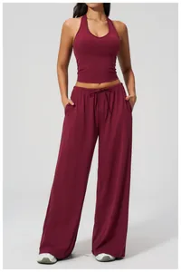 Detail of burgundy yoga set with halter crop top and loose drawstring wide-leg pants