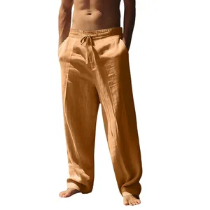 Detail of men's linen pants featuring elastic waistband and drawstring in khaki color