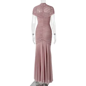 Detail view of the back zipper and ruched mesh fabric on a dusty pink fishtail dress