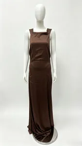 Detail of elegant dark brown satin maxi dress showing silky texture and halter neck design