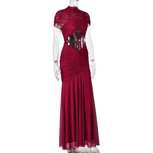 Close-up of ruched wine red evening dress with hollow-out waist and halter neckline
