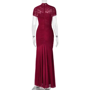 Detailed view of burgundy ruched fabric and back invisible zipper on the evening gown
