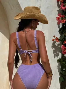 Detail of lavender ribbed bikini set featuring lace-up back design and high waist fit