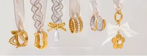Lace series collection of 14K gold plated rings and pendants with pearls on silk ribbons