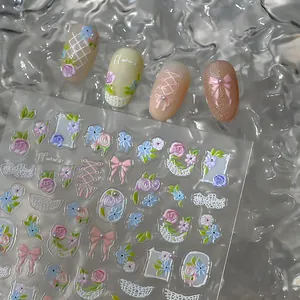 Detail of 5D embossed butterfly and flower nail art stickers on soft background