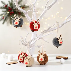 Handmade felt reindeer ornaments with plush balls and wooden heads for Christmas decor