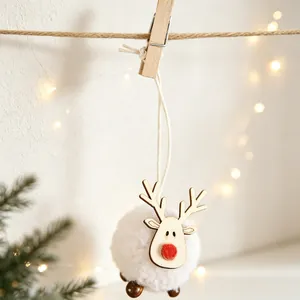 Detail of wooden reindeer ornament with white fuzzy body hanging on jute rope