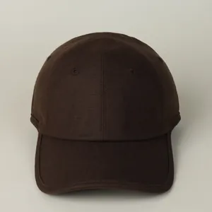 Detail view of high-quality dark brown cotton linen baseball cap with stitching