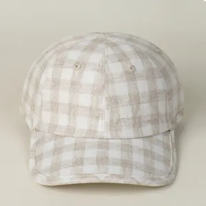 Close-up of beige plaid cotton linen baseball cap showing detailed fabric weave