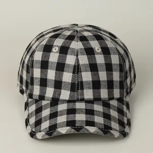 Close-up of breathable cotton linen texture on black and white gingham baseball cap