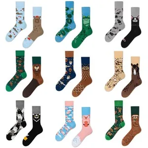 Macro view of cotton mid-tube socks set with asymmetric animal jacquard patterns