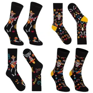 Detail of Day of the Dead knitted socks with Mexican skull and guitar patterns
