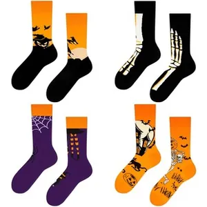Set of four Halloween mid-calf socks with pumpkins, skeletons, and ghost castle motifs
