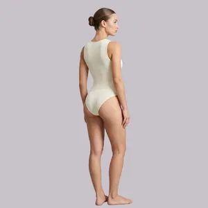 Beige ribbed seamless yoga jumpsuit featuring a slim-fit round neck and sleeveless design