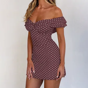 Detail view of the red polka dot mini dress showing off-the-shoulder ruffle sleeves