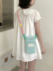 Light blue mesh mobile phone crossbody bag with colorful woven strap for women