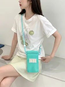 Fresh mint green mesh crossbody phone bag with minimalist cord strap and bead detail