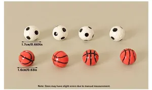 Macro detail of miniature 1.7cm soccer and 1.6cm basketball resin model dimensions