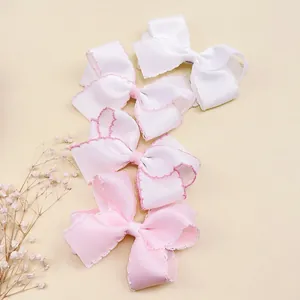 Set aus vier handgefertigten Haarschleifen aus Ripsband für Mädchen in Rosa und Weiß