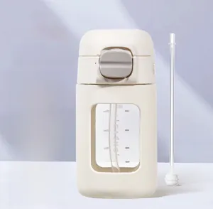 Detailed view of 330ml baby straw cup with gravity ball and volume scale markers