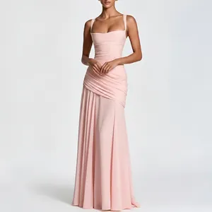 Detailed view of the elegant draping and pleated fabric on this light pink maxi dress