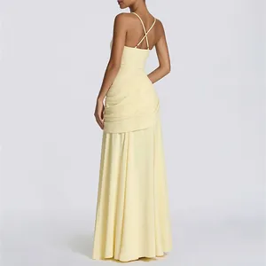 Detail view of backless dress featuring cross straps and elegant pleated drapery