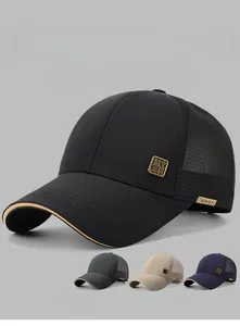 Detail of baseball cap mesh back and gold metal badge on high quality black cotton crown