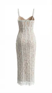 Detail view of white lace dress with corset bones and nude lining on back