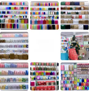 Detailed assortment of colorful paper gift bags with twisted handles and festive patterns