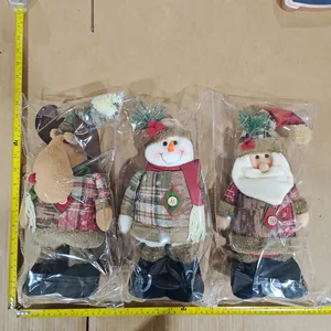 Detailed view of plush Christmas doll set with reindeer, snowman and Santa in plaid fabric
