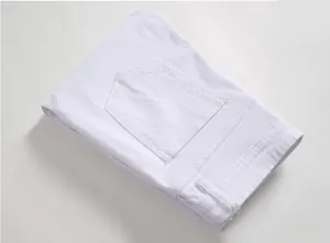 Close-up of white distressed denim jeans showing back pocket stitching and belt loops