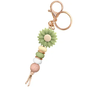 Daisy sunflower keychain with green silicone flower and wooden beads hanging