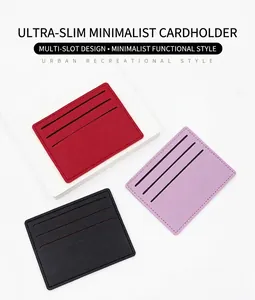 Close-up of minimalist ultra-thin card holders in red, purple, and black faux leather