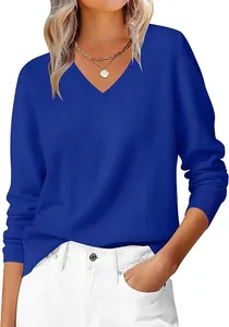 Detail of ribbed cuffs and hem on a classic navy blue V-neck knitted sweater for women