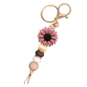 DIY handmade sunflower beaded keychain with colorful silicone beads and rose gold metal clasp