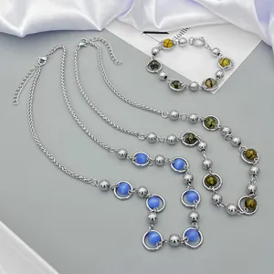 Titanium steel necklace set with blue cat-eye stone beads and silver chain layering