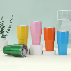 Group of 30oz insulated stainless steel tumblers in multiple colors on white pedestals