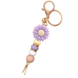 DIY Daisy keychain with purple sunflower silicone charm and colorful beaded ornaments