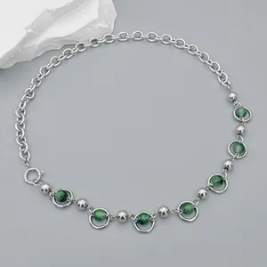 Retro titanium steel chain necklace featuring green cat eye stones in silver rings