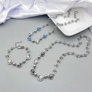 Titanium steel necklace with blue cat eye beads set on white silk background