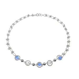 Detailed view of silver knot chain with blue and white cat eye stone beads pendant
